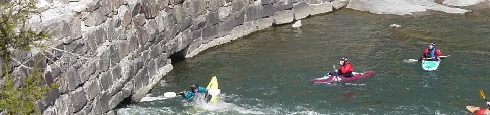 Kayakers Playing Around Old Minig Company Dam