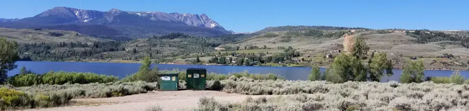 Cow Creek south sage field with reservoir and mountains in background