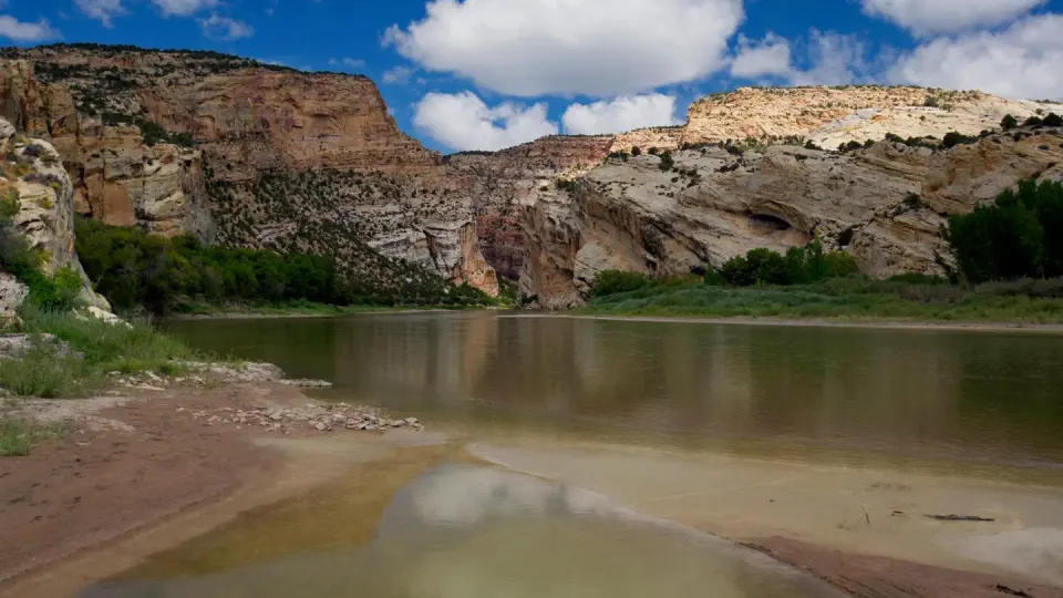 The Deerlodge Park Area showing red rock cliffs and the Yampa River at the head of Yampa Canyon